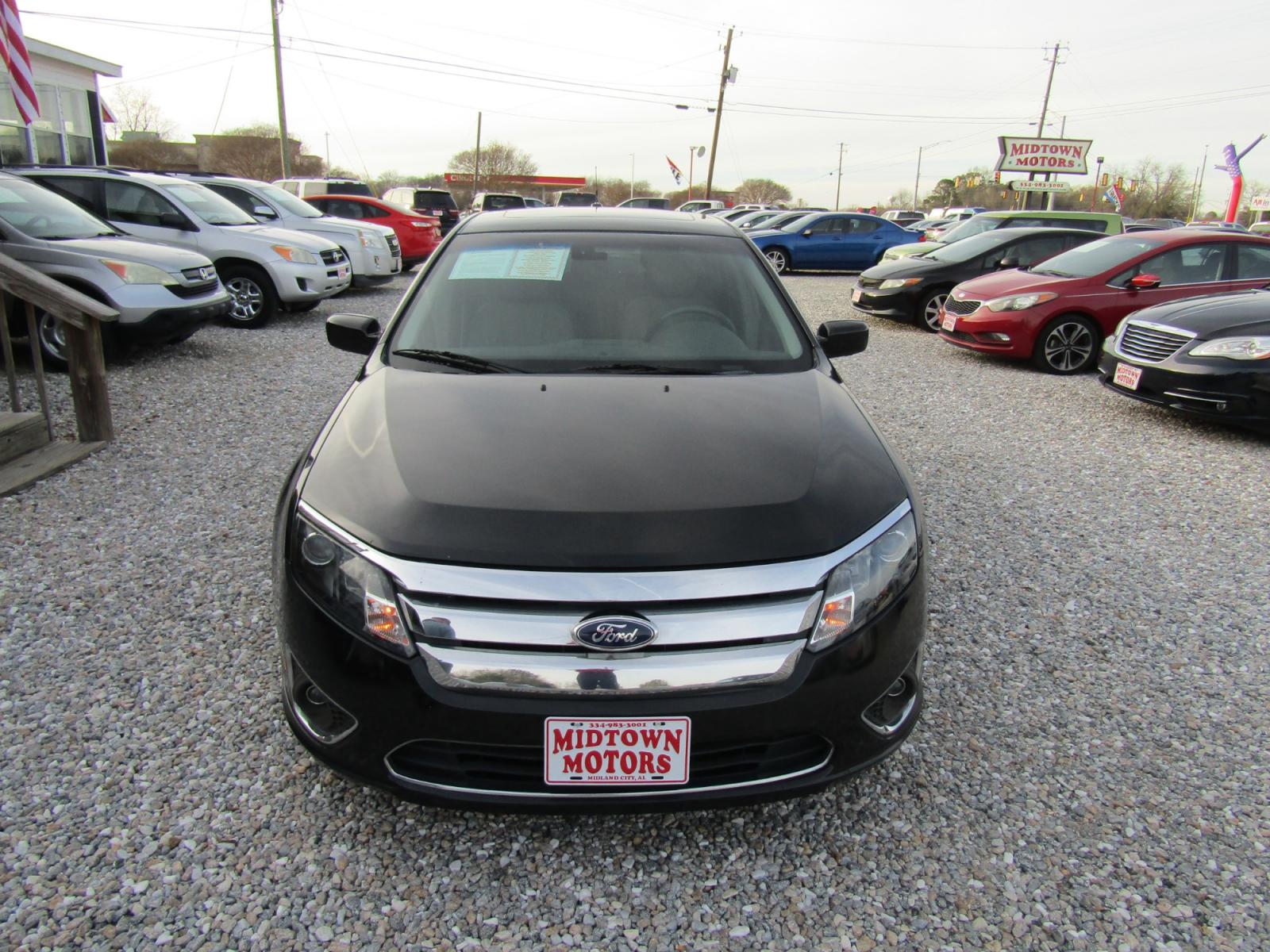 2011 Black /Tan Ford Fusion (3FAHP0JG4BR) , Automatic transmission, located at 15016 S Hwy 231, Midland City, AL, 36350, (334) 983-3001, 31.306210, -85.495277 - Photo #1